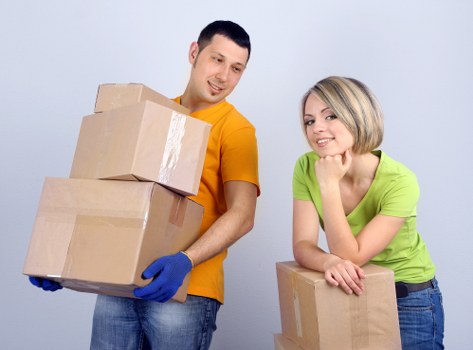 Organised moving boxes labelled for rooms in a Sutton property