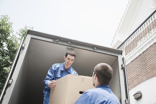Packed moving boxes and furniture prepared for a Sutton house removal