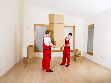 Movers handling desks and IT items in a Sutton office move