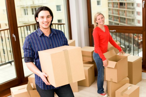 Loading furniture into a removals van in Sutton