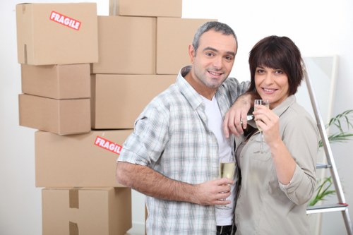 Professional movers handling furniture and household items in Sutton